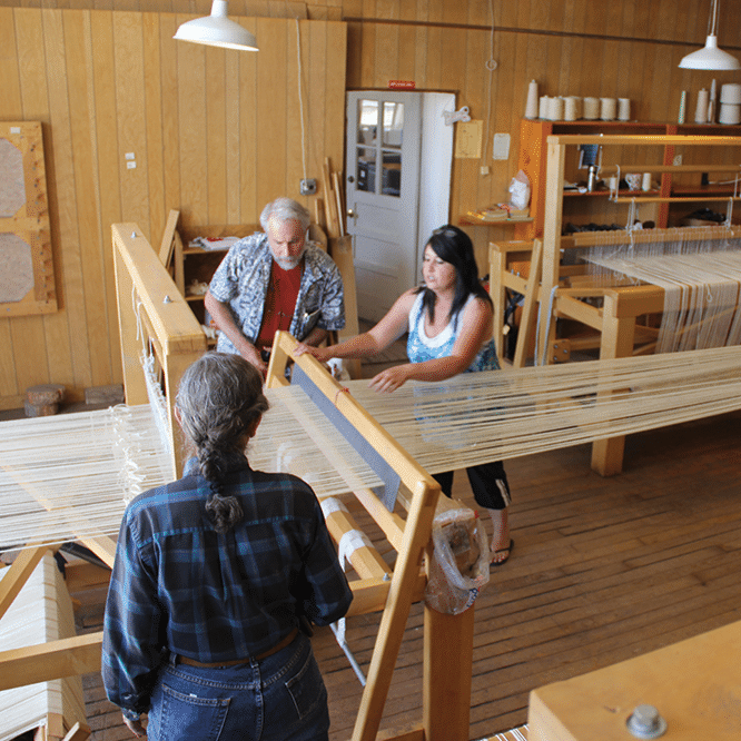 Man and woman weaving